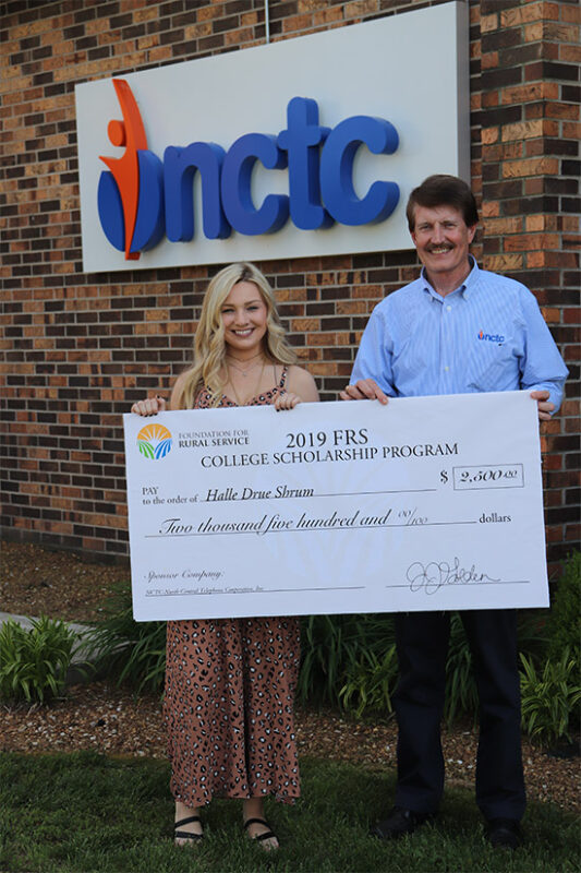 Halle Shrum and NCTC CEO Johnny McCalahan with $2,500 foundation for rural services scholarship check